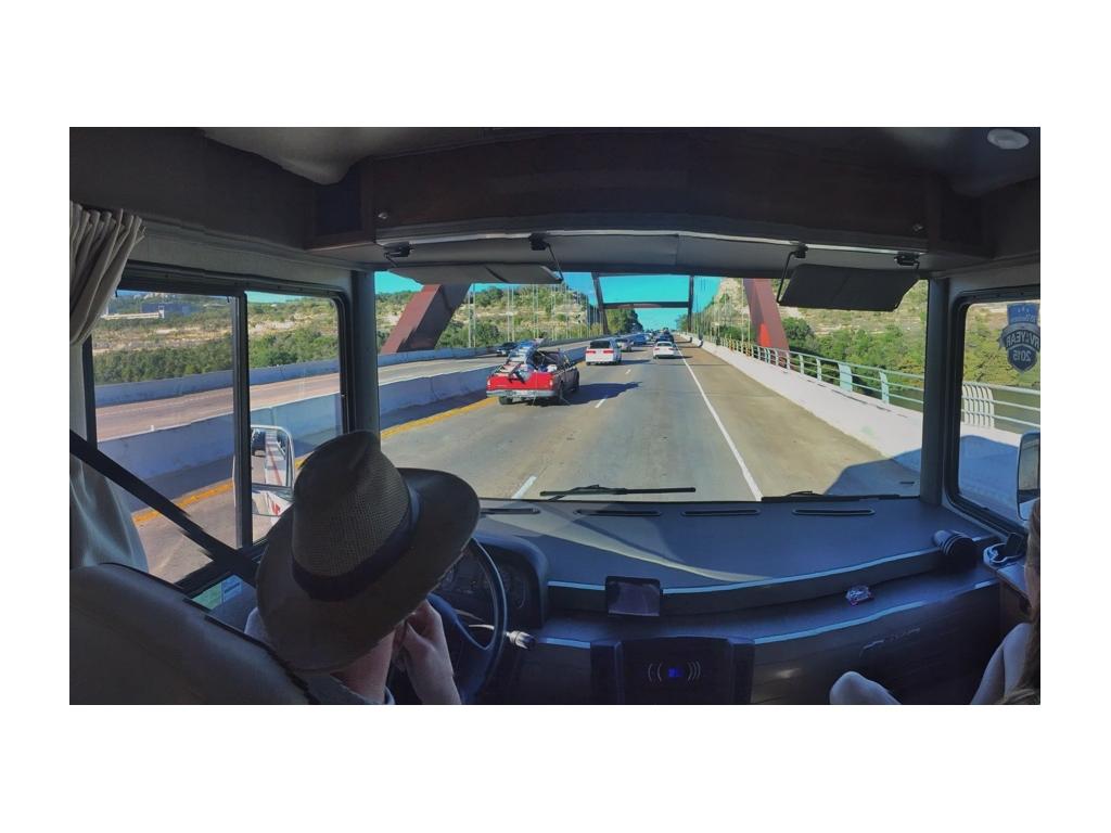 Heath driving along a busy highway.