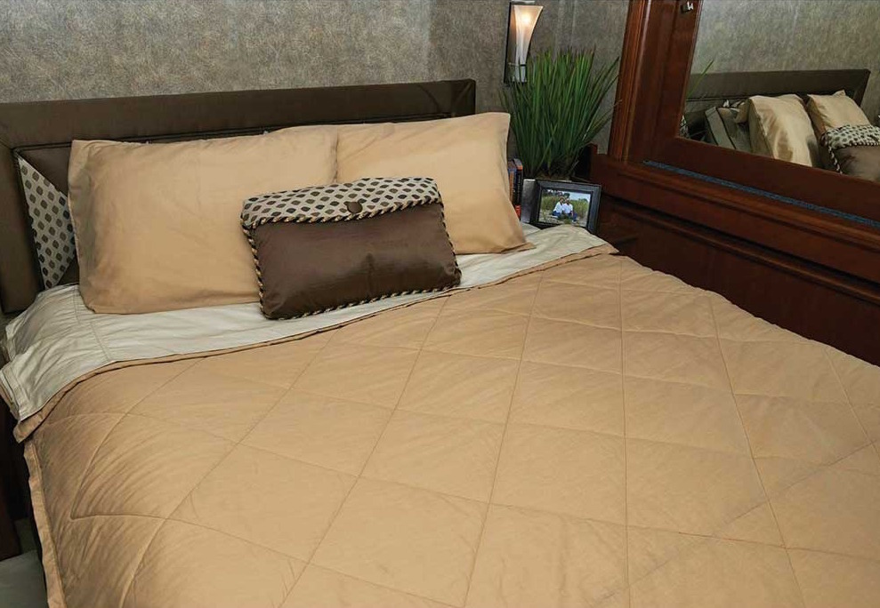 Nicely made bed.
