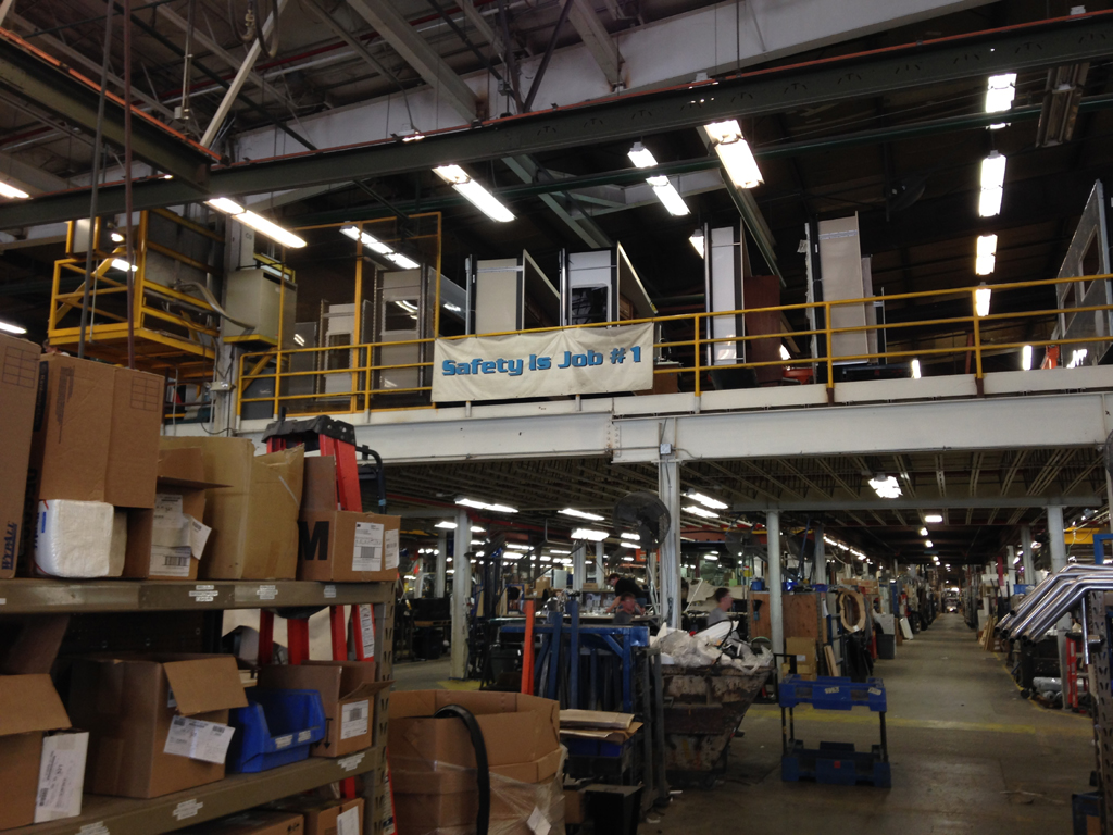 Sign on walkway in factory that reads, "safety is job #1."