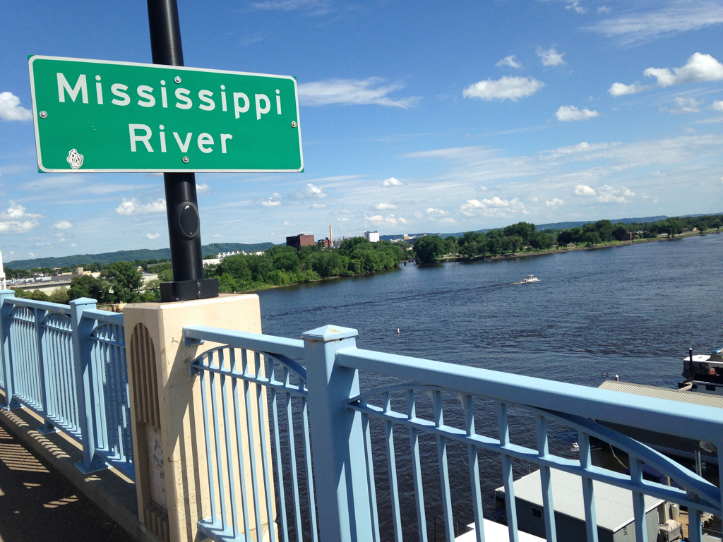 Sign for the Mississippi on bridge above the river.