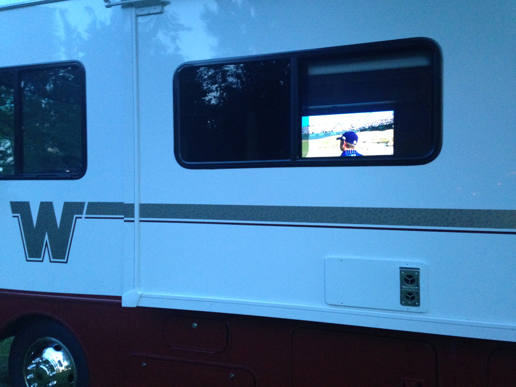 TV visible through window of Winnebago motorhome