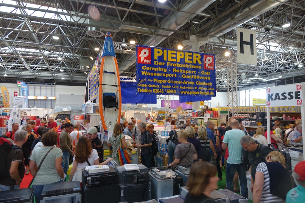 Crowds gathered among vendor supply displays.