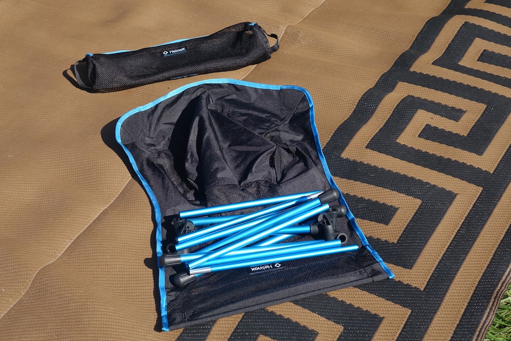 Helinox chair disassembled on mat.