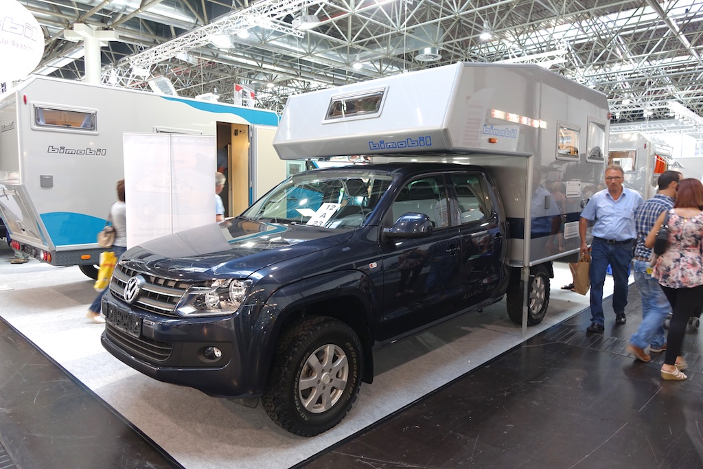 VW truck with camper unit built on it.