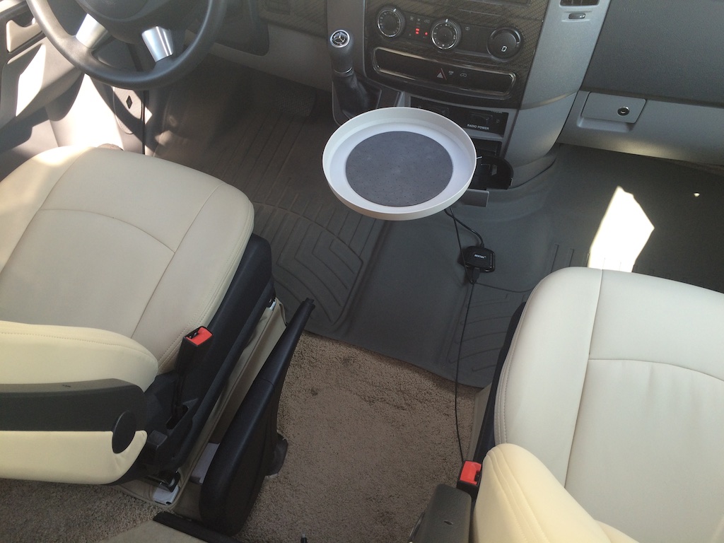 Small travel tray between driver and passenger seat.