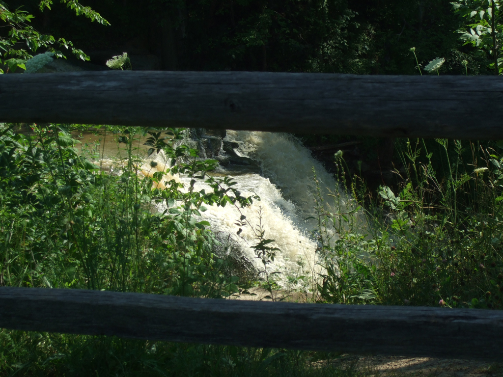 Wooden fence with Brandywine Falls behind it.