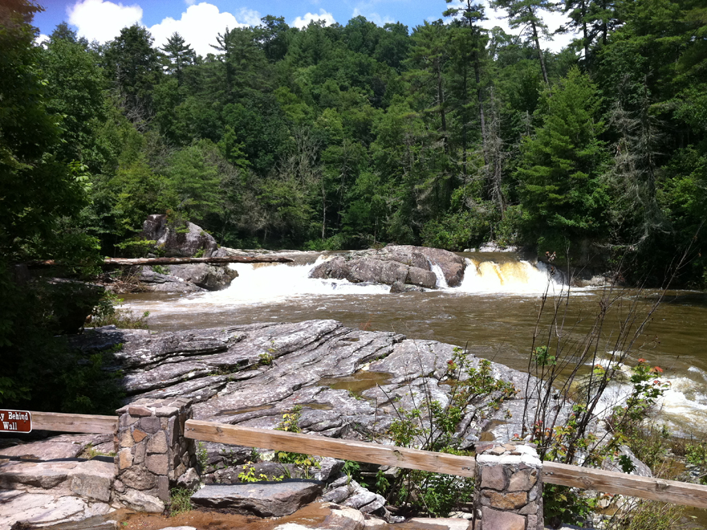 Smaller but beautiful Linville Falls among the trees and rocky shoreline.