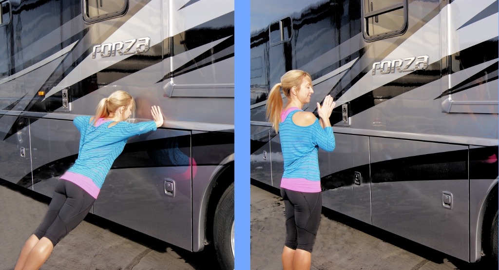 Stef leaning against a Winnebago Forza and pushing off to clap.