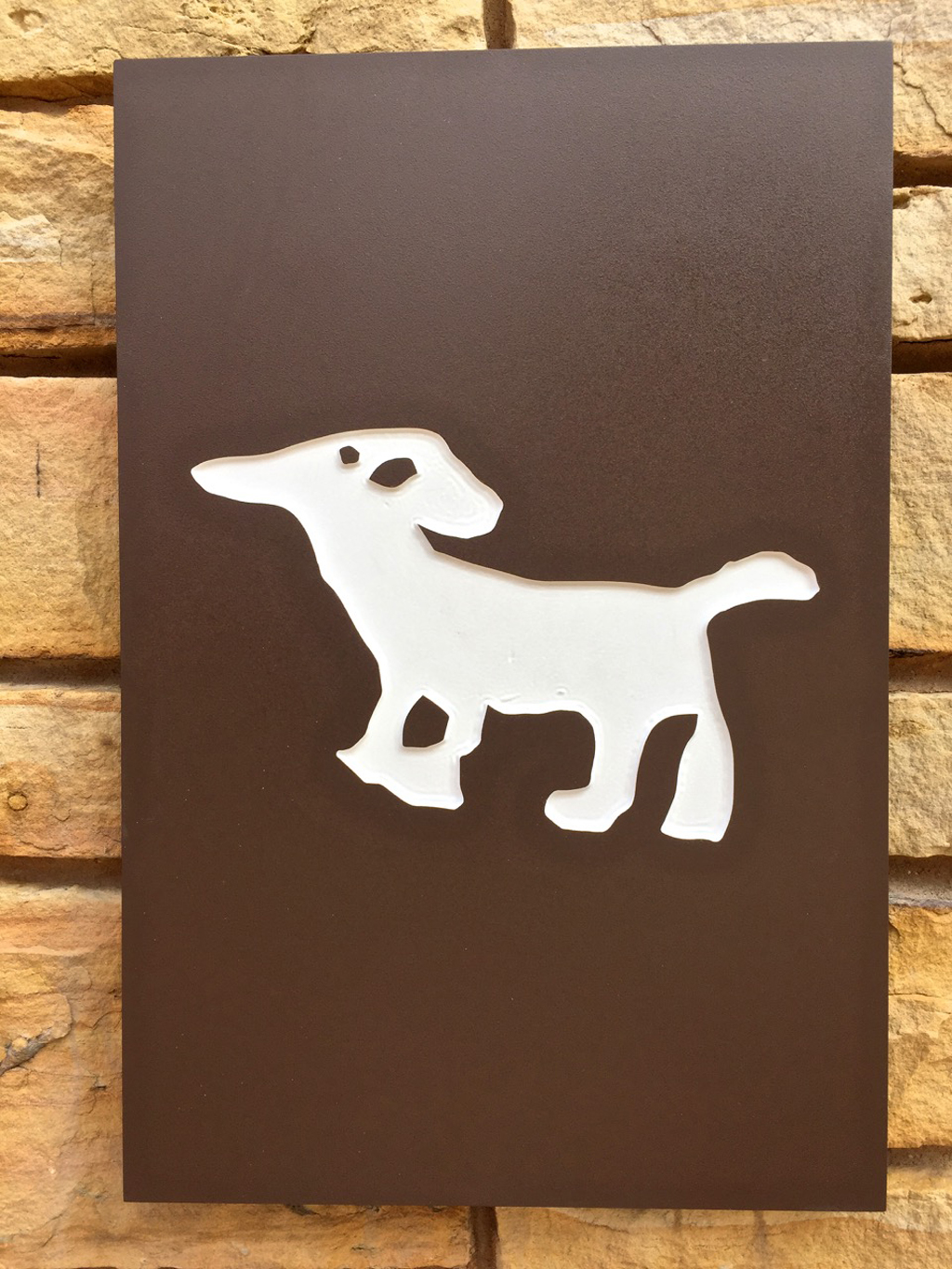 Artwork of a dog petroglyph.
