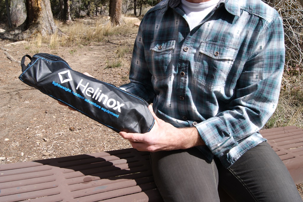 James holding Helinox table carrier.
