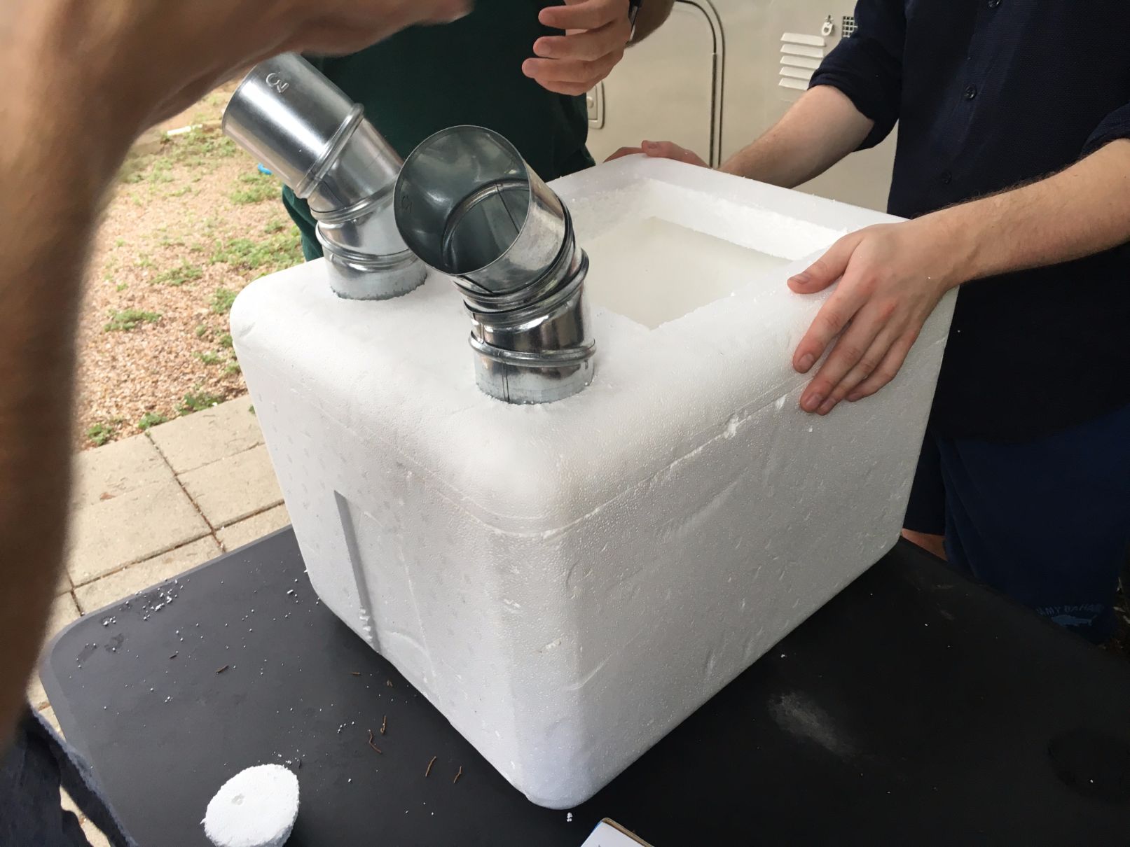Styrofoam cooler turned into a homemade air conditioner.
