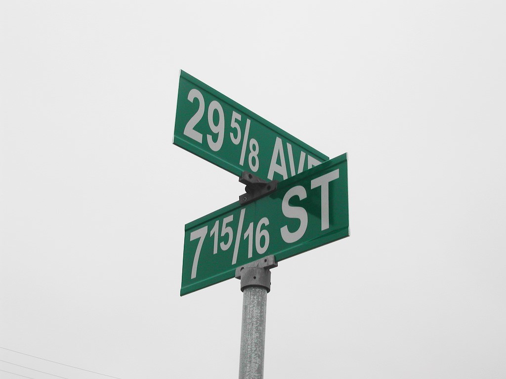 Street sign with 29 5/8 Ave & 7 15/16 Street.