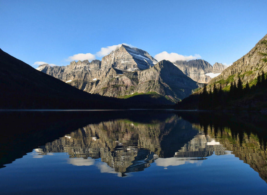 Water reflecting the mountains and Grinnell glacier.