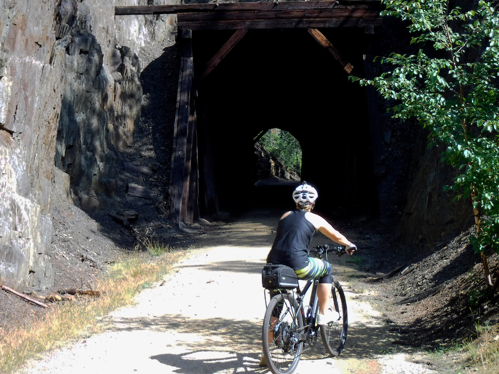 Biker about to go through a tunnet.