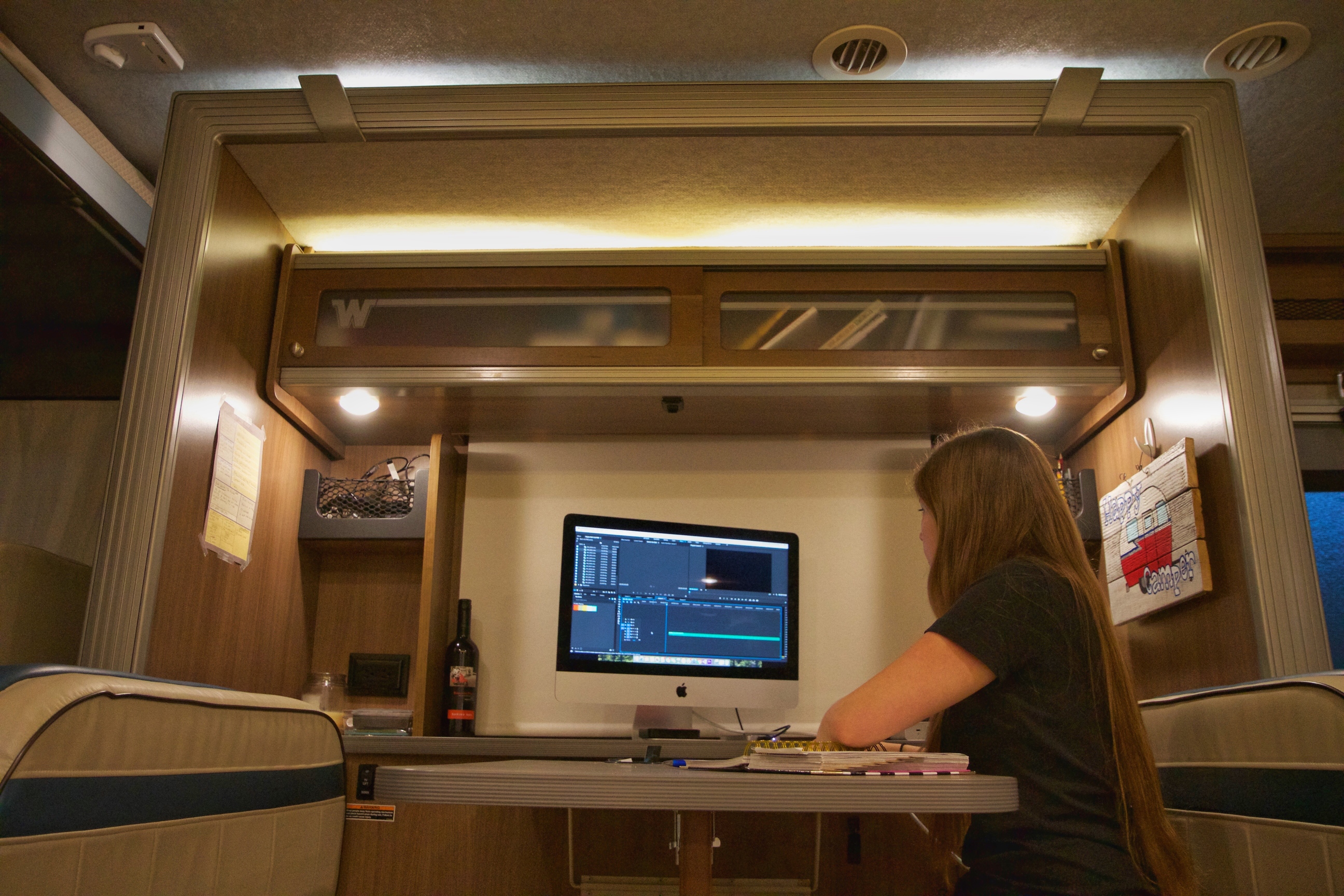 Alyssa working at dinette on her larger computer.