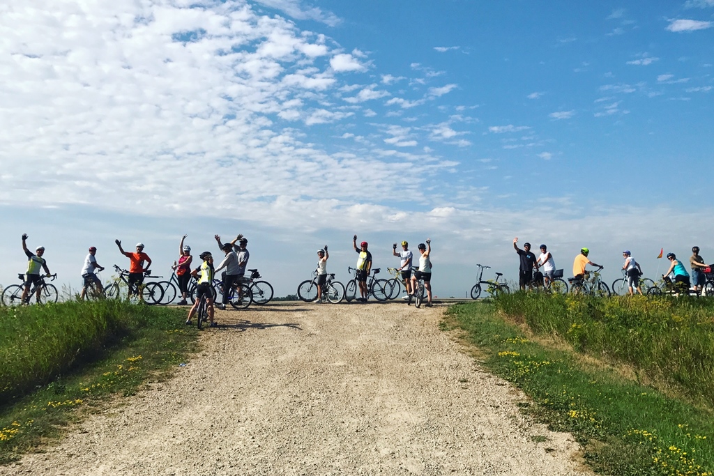 Group of people riding their bikes.